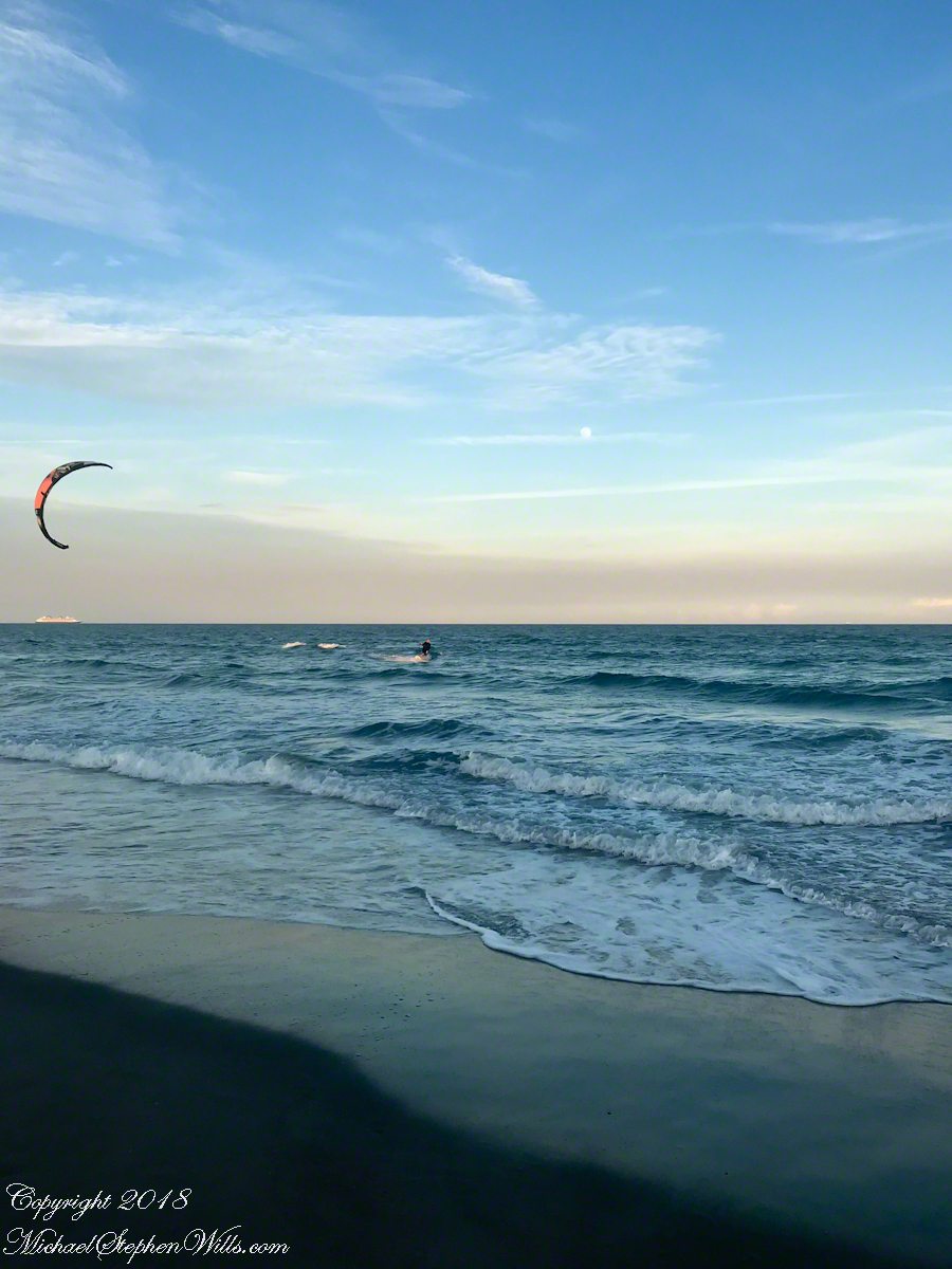 Risen Full Moon and Surf Boarder at Sunset with cruise ship